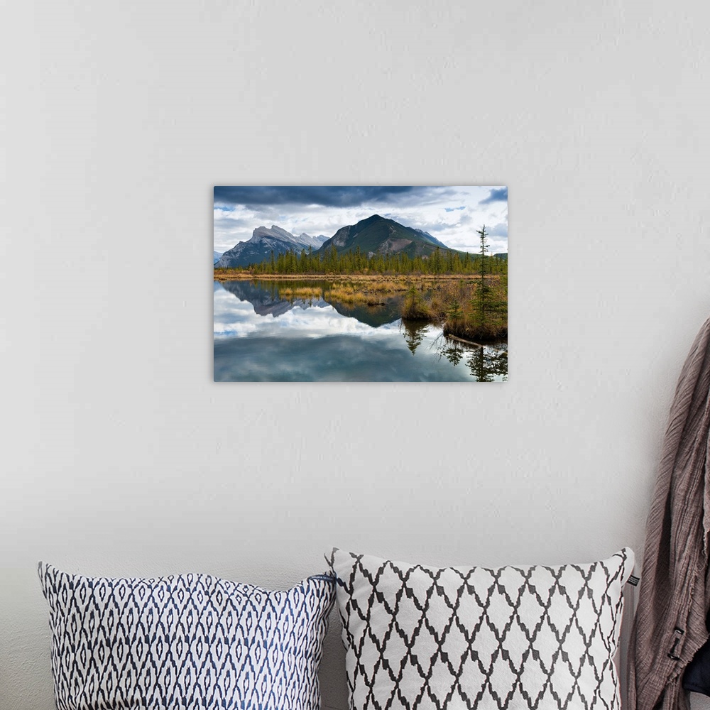 A bohemian room featuring Reflections across Vermilion Lakes with view of Mount Rundle and Sulfer Mountain in the distance....