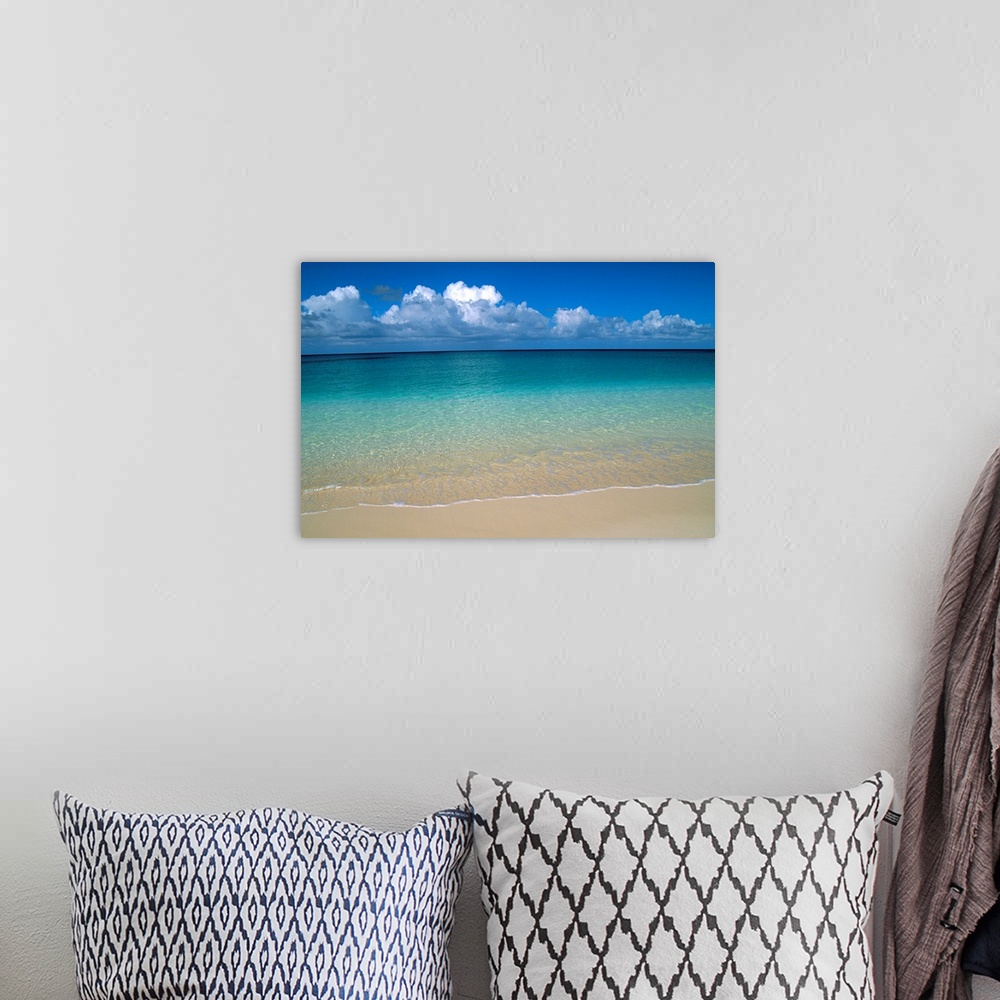 A bohemian room featuring Calm Shoreline Water With Many Different Shades Of Blue