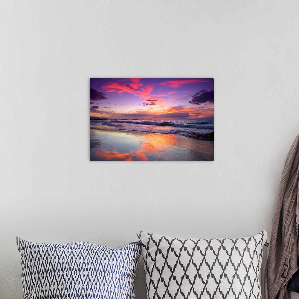 A bohemian room featuring Large photograph of waves crashing on Maui shore  as the sun sets behind the clouds.