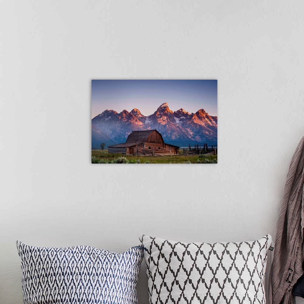 A bohemian room featuring Barn in front of the mountains, color photography