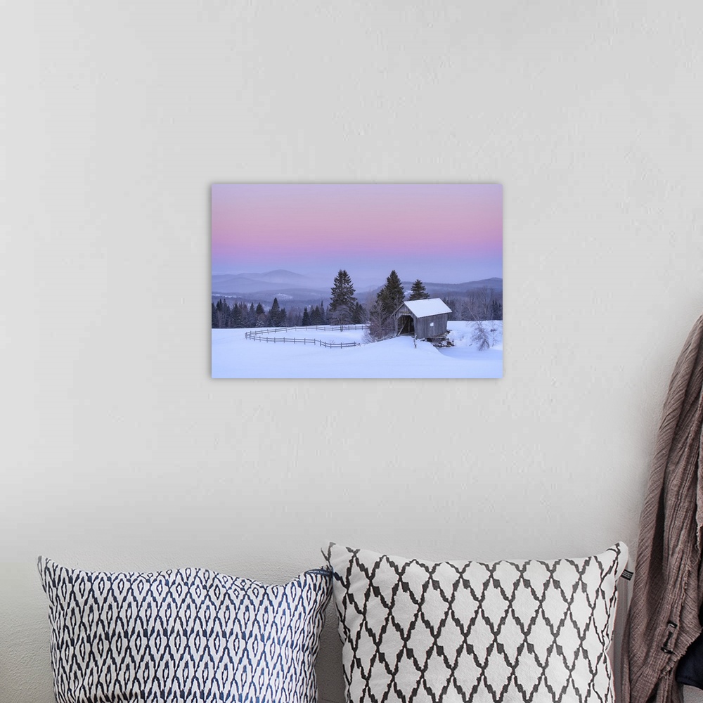 A bohemian room featuring Landscape photograph of a rural Winter scene with fog covered mountains in the background and a b...