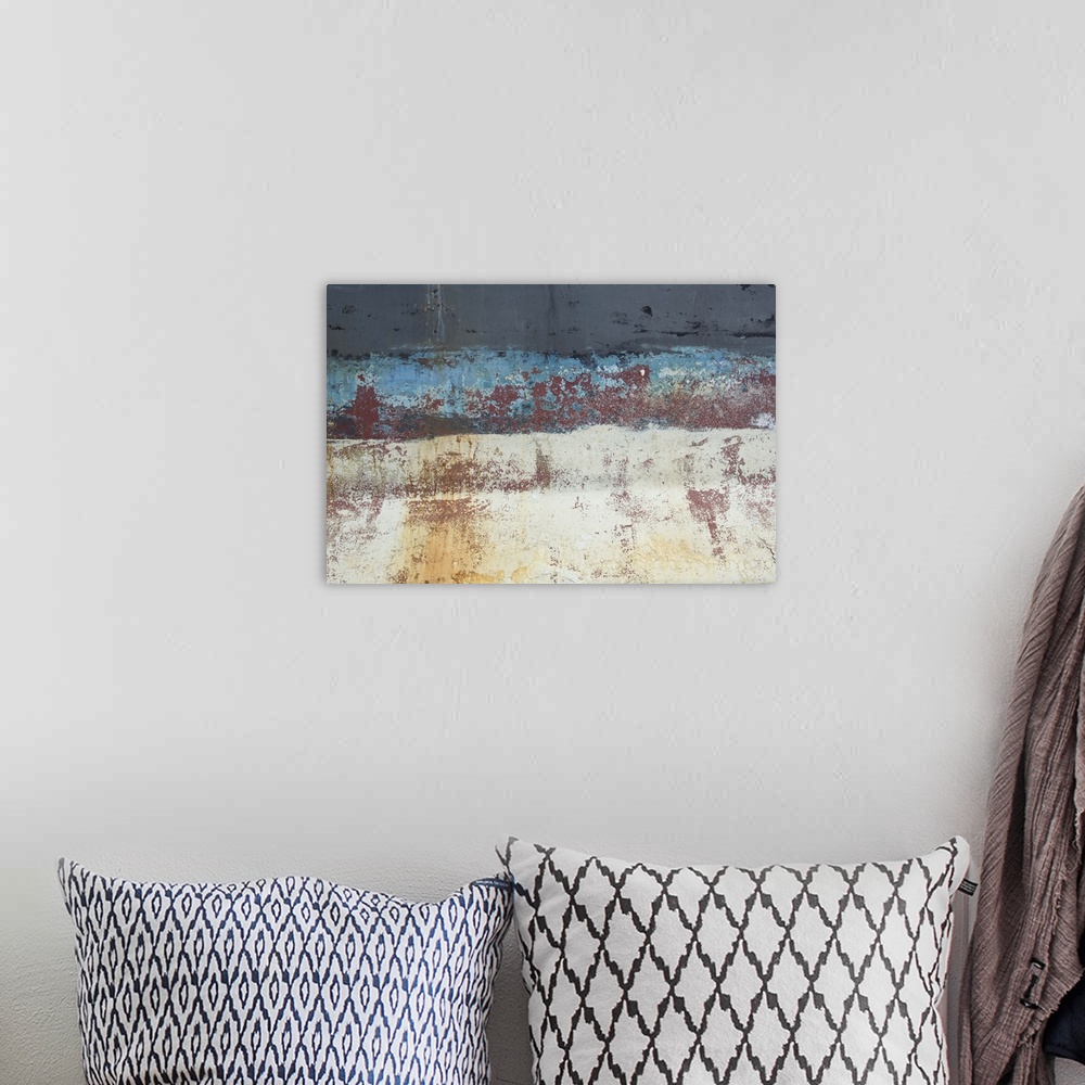 A bohemian room featuring An artistic photograph of a close abstract view of a ships hull looking weathered and rusty.