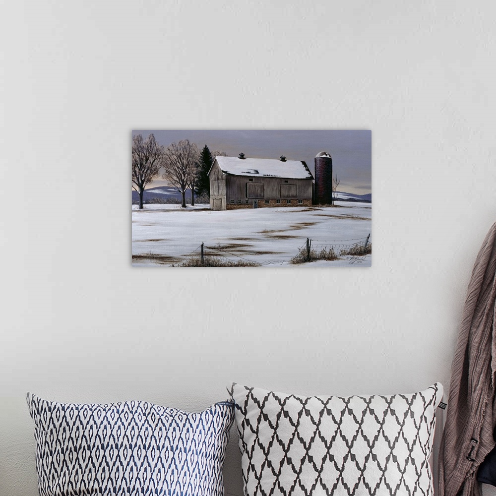 A bohemian room featuring An old barn and silo in a meadow with snow on the ground.