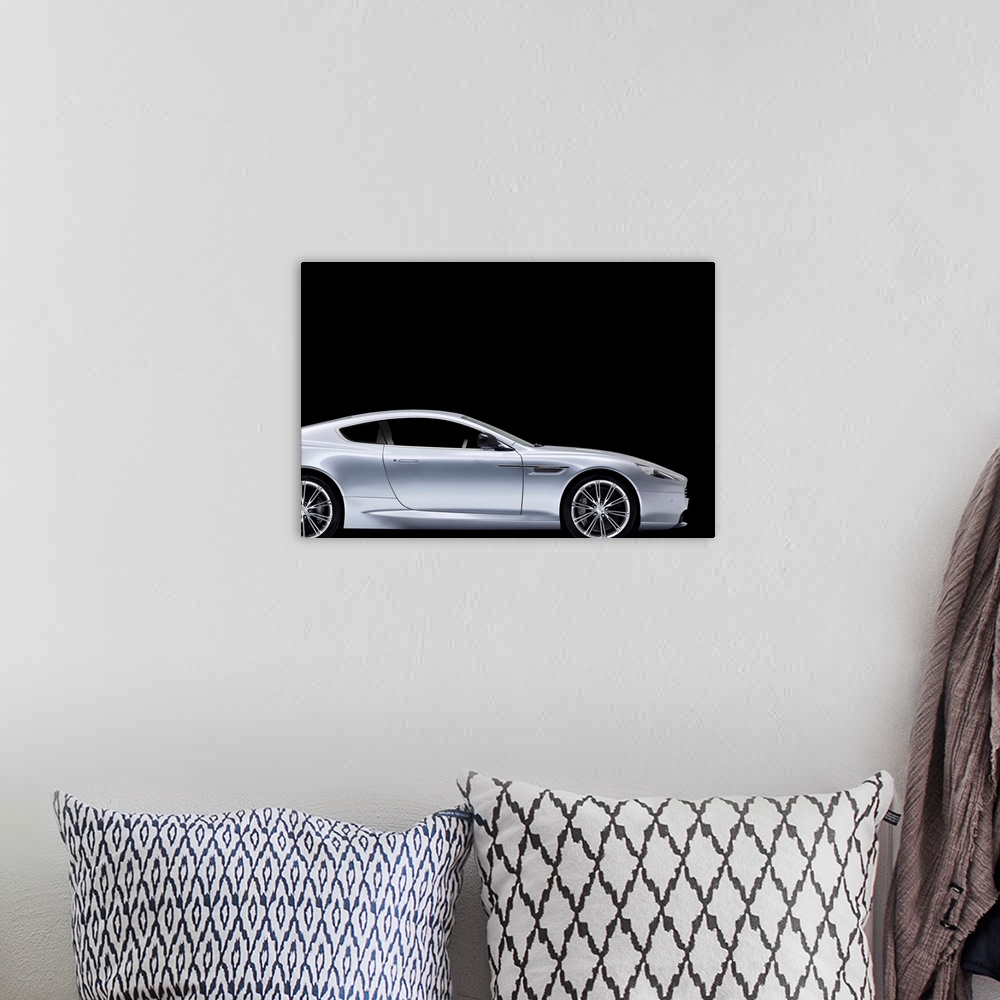 A bohemian room featuring Aston-Martin DB9