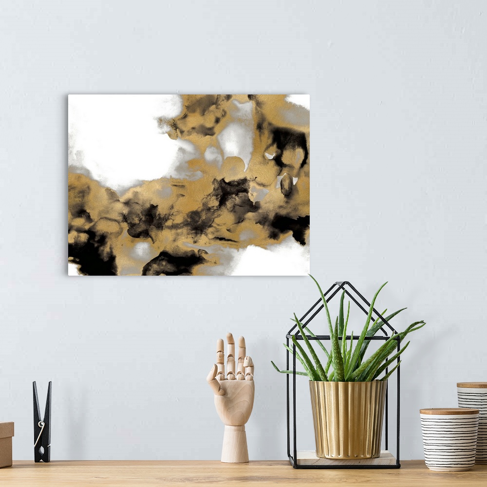A bohemian room featuring Abstract art with metallic silver and gold with black splotches on a solid white background.