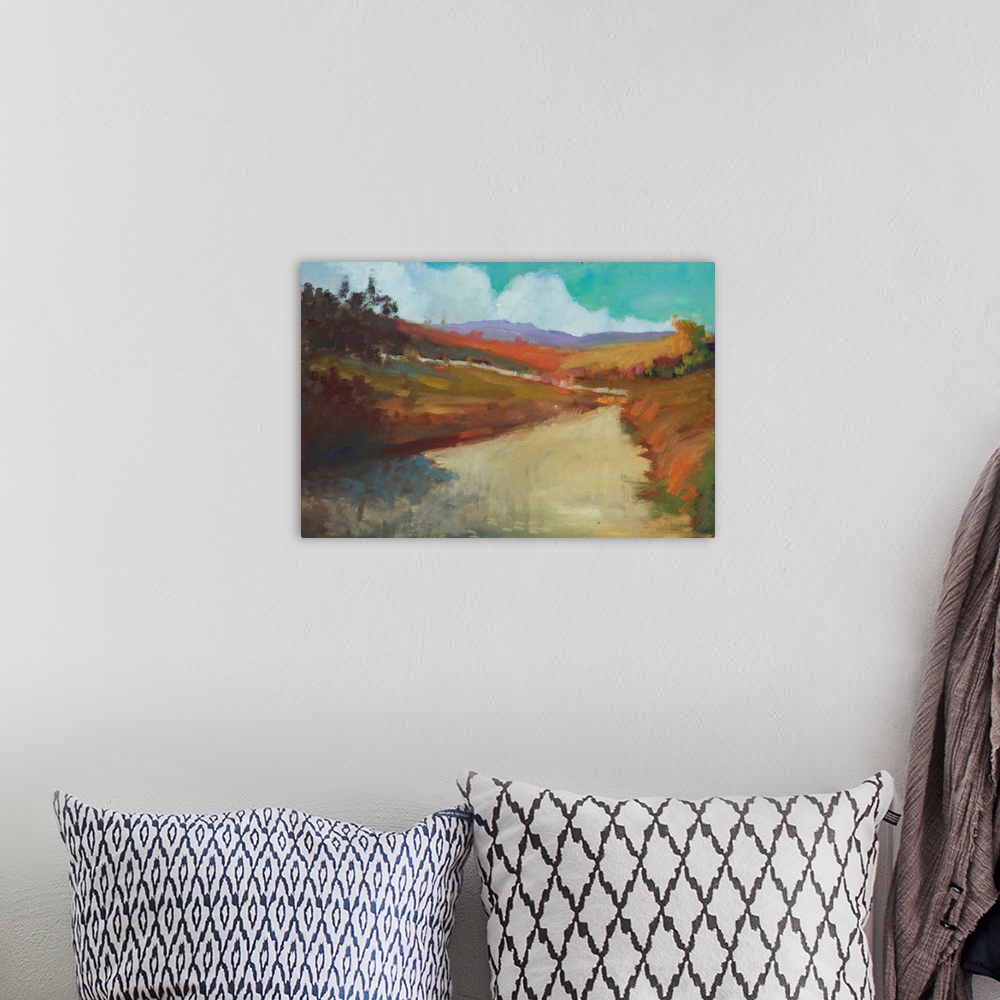 A bohemian room featuring Contemporary landscape painting of a road leading through colorful hills and trees.
