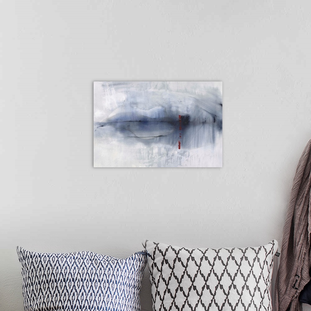 A bohemian room featuring Large abstract painting with faded blues and gray with black and red lines.