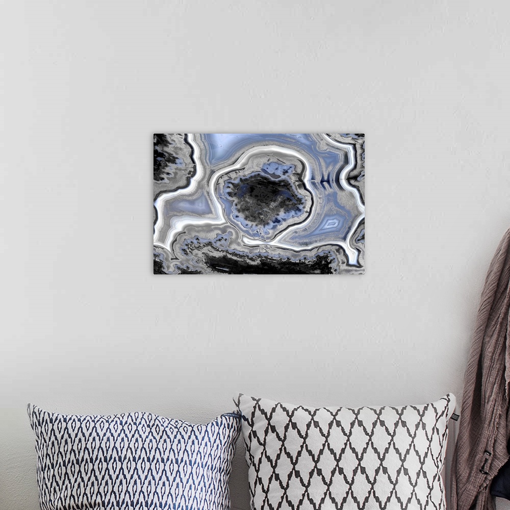 A bohemian room featuring Decor with a blue, white, black, and gray agate pattern.