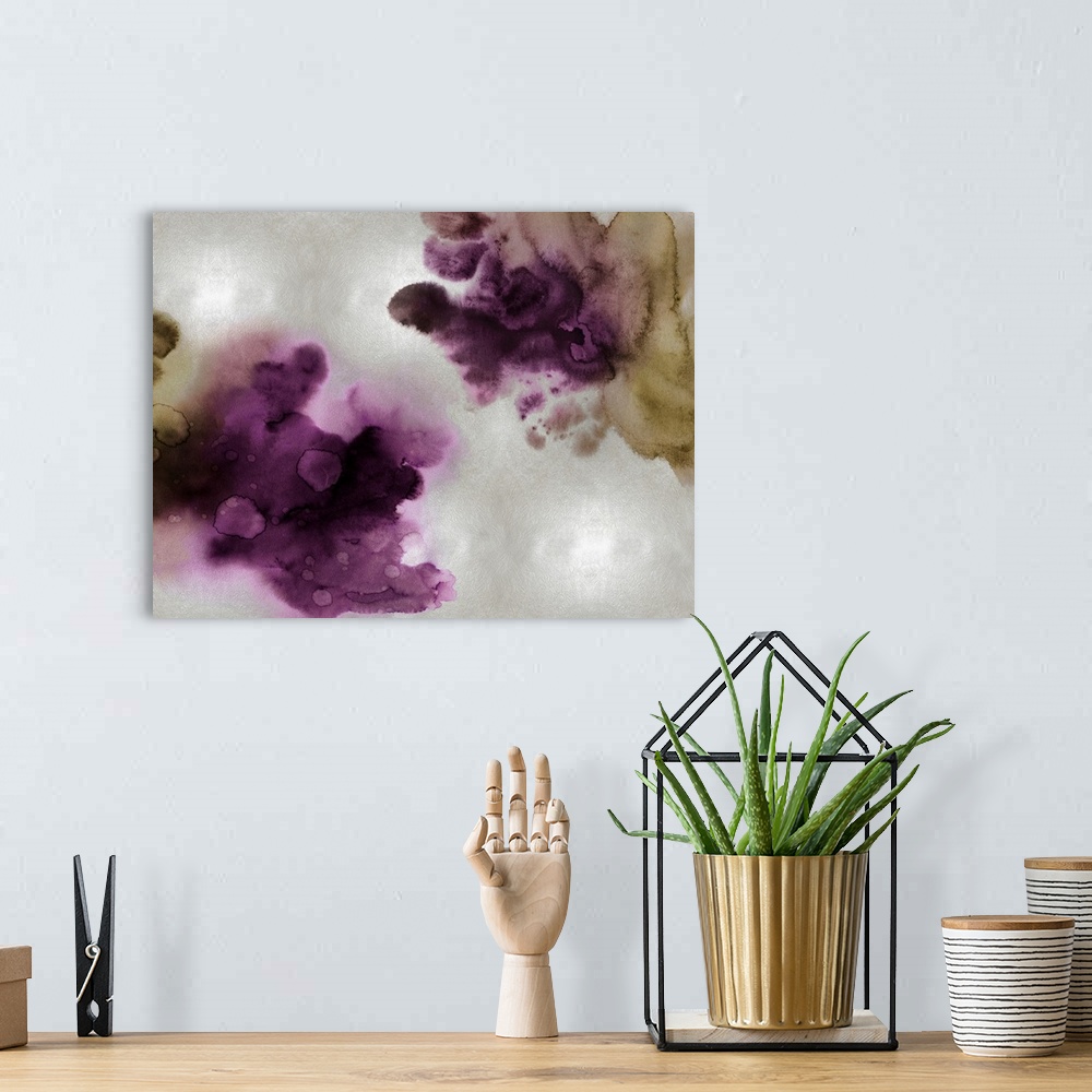 A bohemian room featuring Abstract painting with deep purple and gold hues splattered together on a silver background.