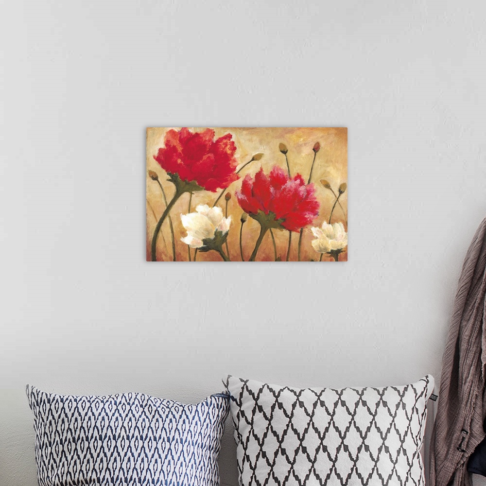 A bohemian room featuring A horizontal contemporary painting of white and red flowers against a warm neutral background.