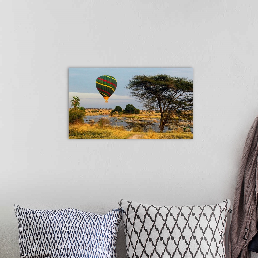 A bohemian room featuring Africa. Tanzania. Hot air balloon crossing the Mara river in Serengeti NP.