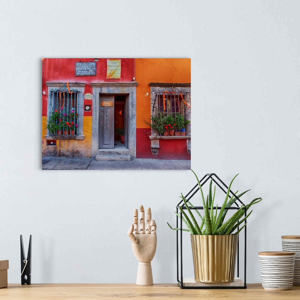 A bohemian room featuring Back streets of the town with colorful buildings.