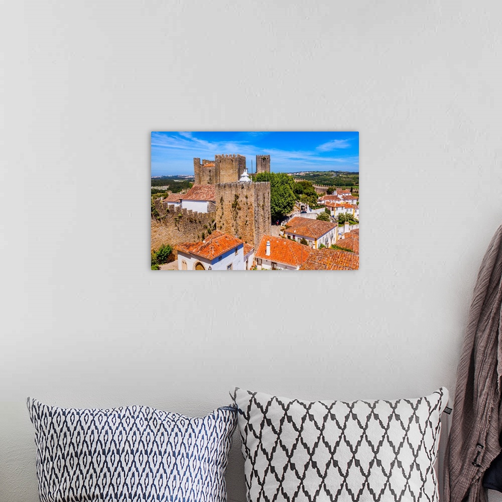 A bohemian room featuring Castle Wals Turrets Towers Medieval Town Obidos Portugal. Castle and walls built in 11th century ...