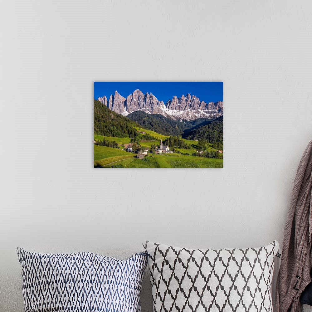 A bohemian room featuring Italy, Dolomites, Val di Funes. Chapel of St. Magdalena in village. Credit: Jim Nilsen