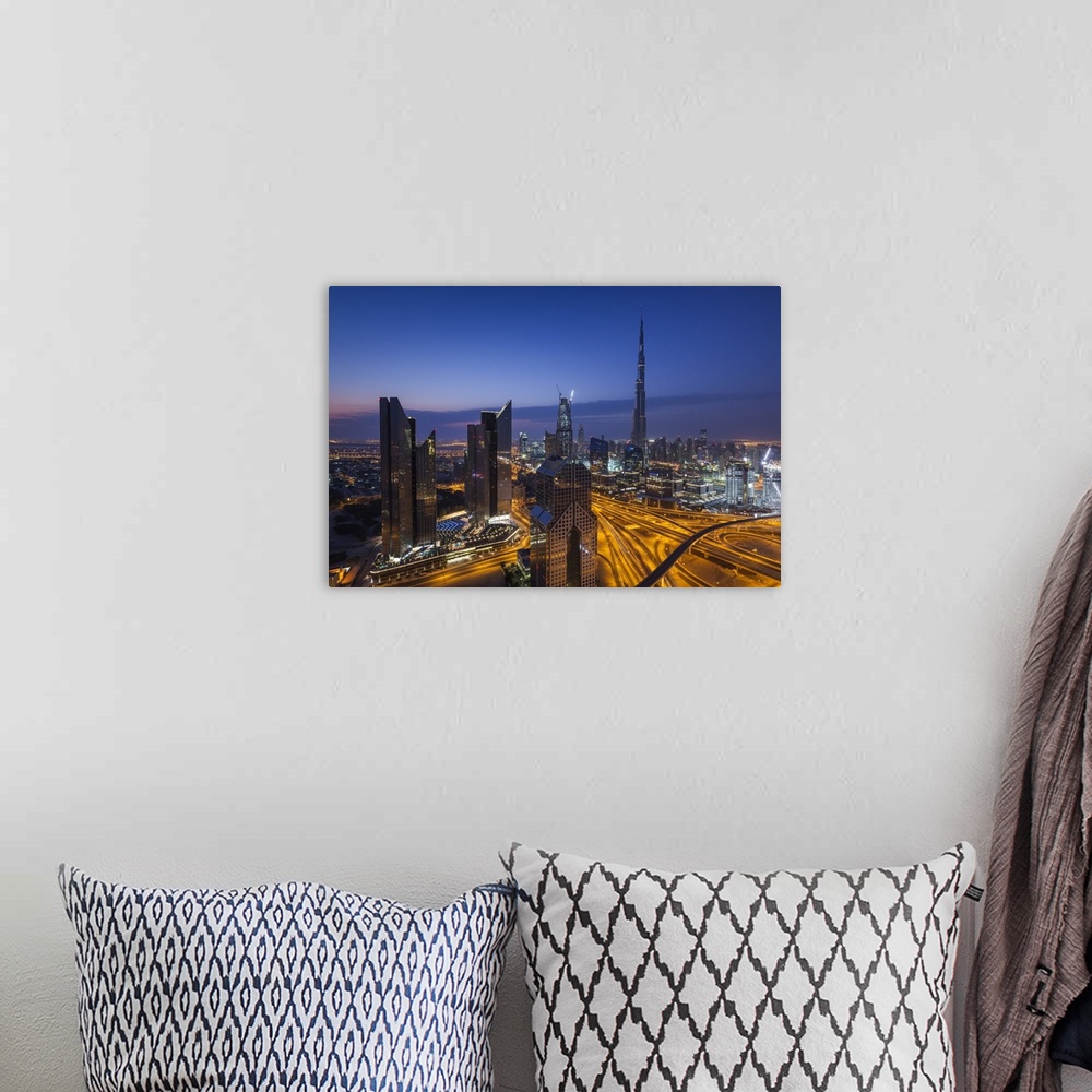 A bohemian room featuring UAE, Dubai, Downtown Dubai, eleavted view over Sheikh Zayed Road and Burj Khalifa Tower, world's ...