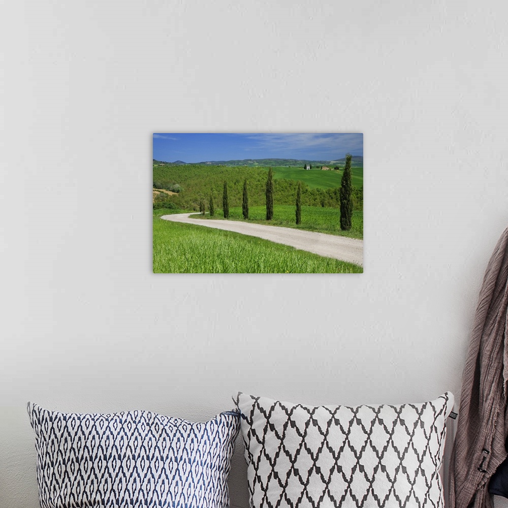 A bohemian room featuring Europe, Italy, Tuscany. Dirt road with Vitaleta Chapel in distance.
