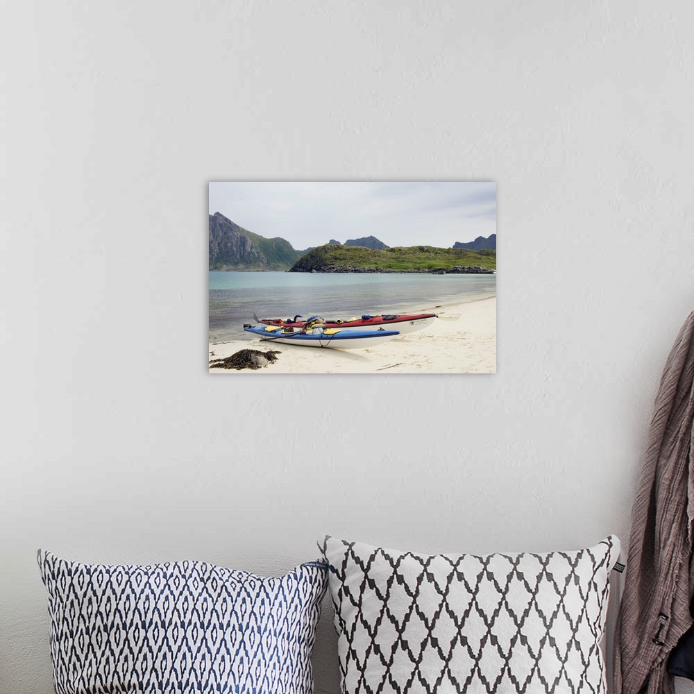 A bohemian room featuring Europe, Norway, Vesteralen. Sea kayaks on beach at Hovden.