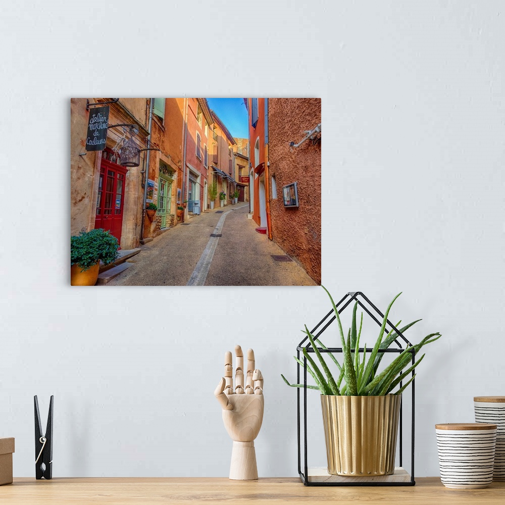 A bohemian room featuring France, Provence, Roussillon, Town scenes of colorful French Hillside town.