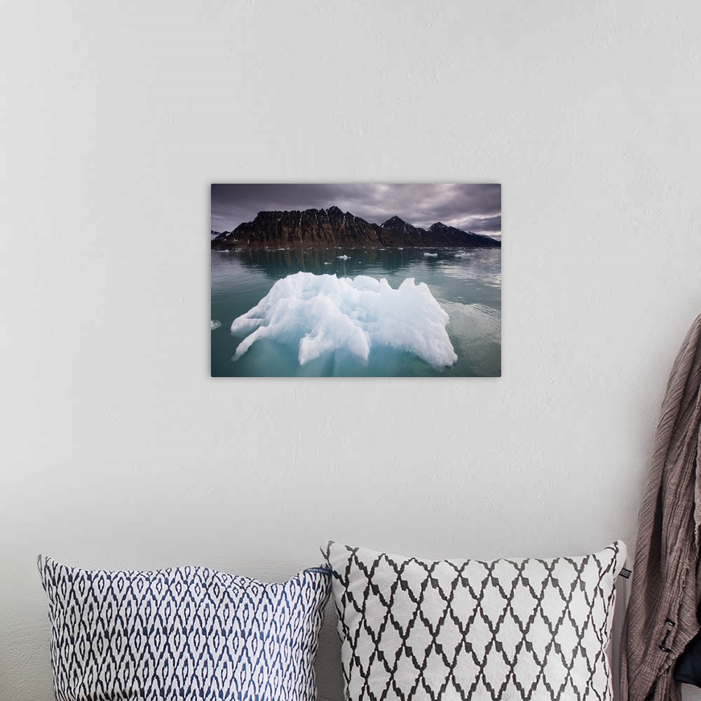 A bohemian room featuring Norway, Svalbard, Spitsbergen, Iceberg floating in Lillieh kfjorden in Krossfjorden on summer mor...
