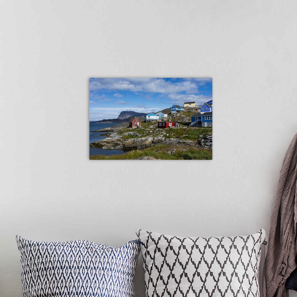 A bohemian room featuring Greenland. Itilleq. Colorful houses dot the hillside.