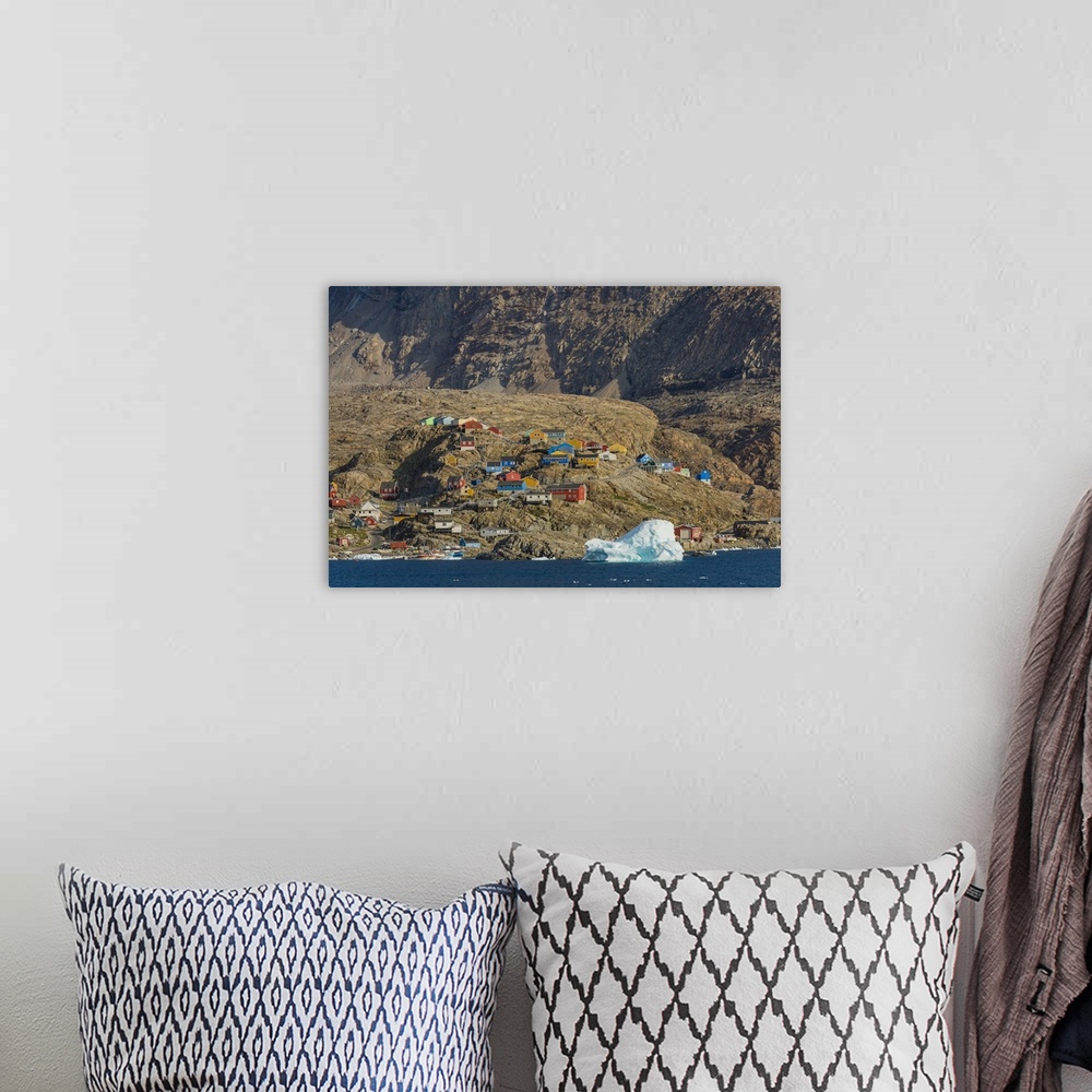 A bohemian room featuring Greenland. Uummannaq. Colorful houses dot the rocky landscape.