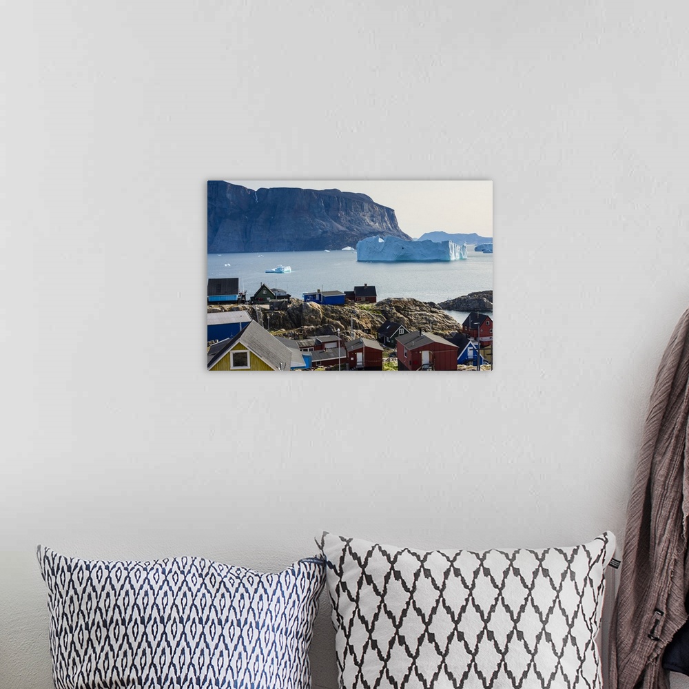 A bohemian room featuring Greenland. Uummannaq. Colorful houses dot the rocky landscape.