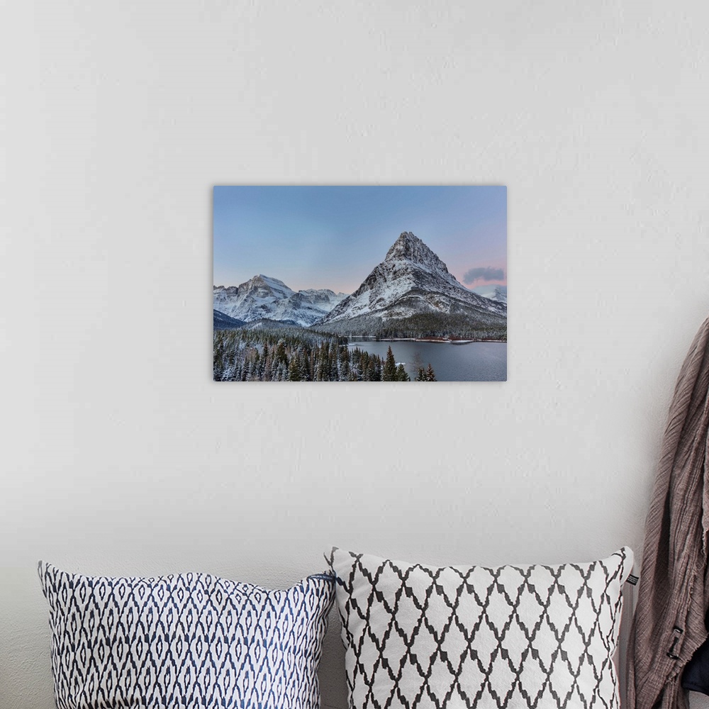 A bohemian room featuring Grinnell Point and Mount Gould over Swiftcurrent Lake in ealry winter in Glacier National Park, M...