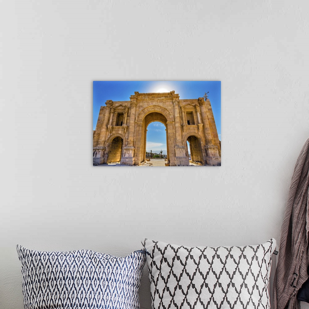A bohemian room featuring Hadrian's Arch Gate Sun Ancient Roman City Jerash Jordan. Jerash came to power 300 BC to 100 AD a...