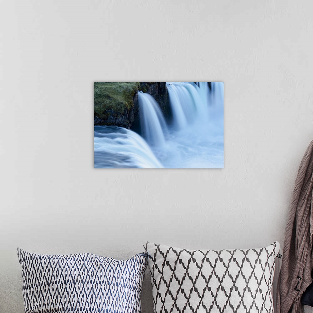 A bohemian room featuring Iceland, Godafoss Waterfall. Some of the small falls on the edges of the main fall look blue in t...