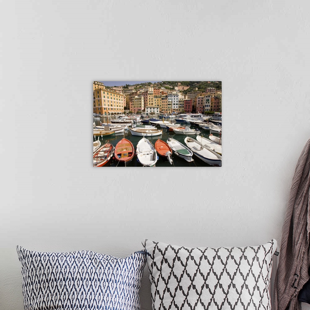 A bohemian room featuring Europe, Italy, Camogli.  Boats moored in harbor with colorful town buildings in background.