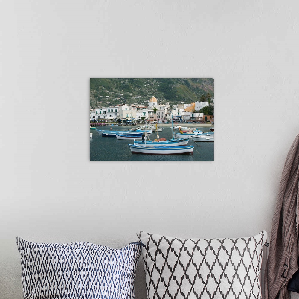 A bohemian room featuring ITALY-Campania-(Bay of Naples)-ISCHIA-FORIO:.Town View from Fishing Port / Daytime