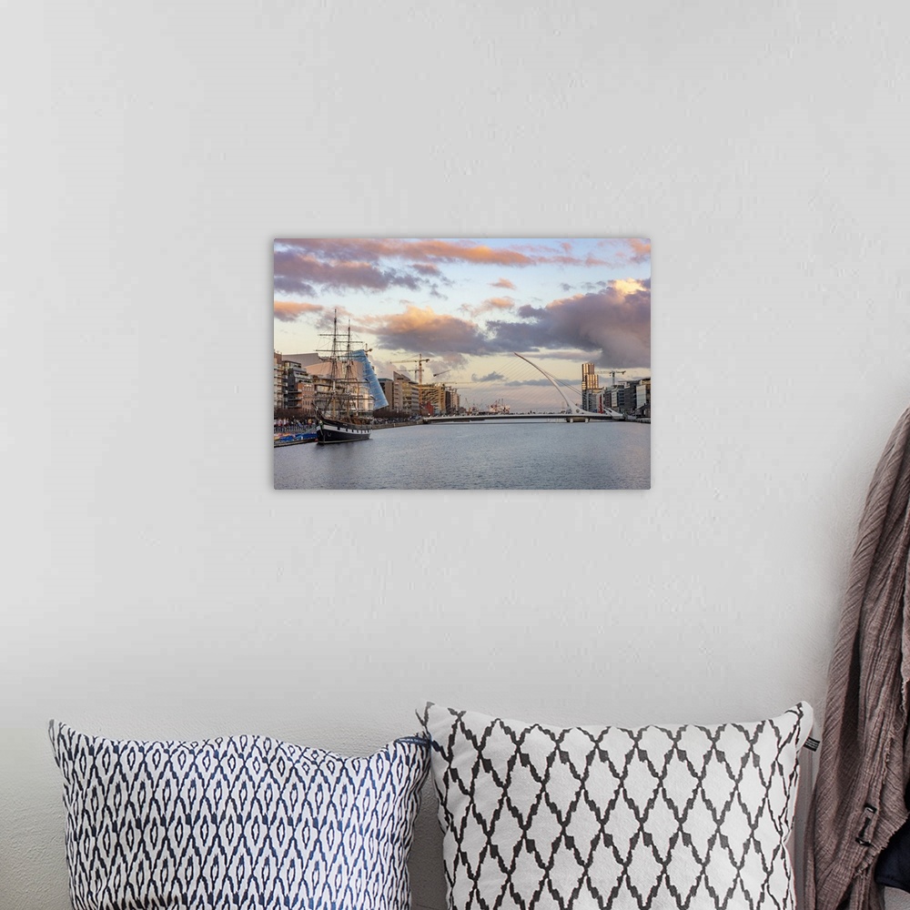 A bohemian room featuring Jeanie Johnston Tall Ship and Samuel Beckett Bridge over the River Liffey in downtown Dublin, Ire...