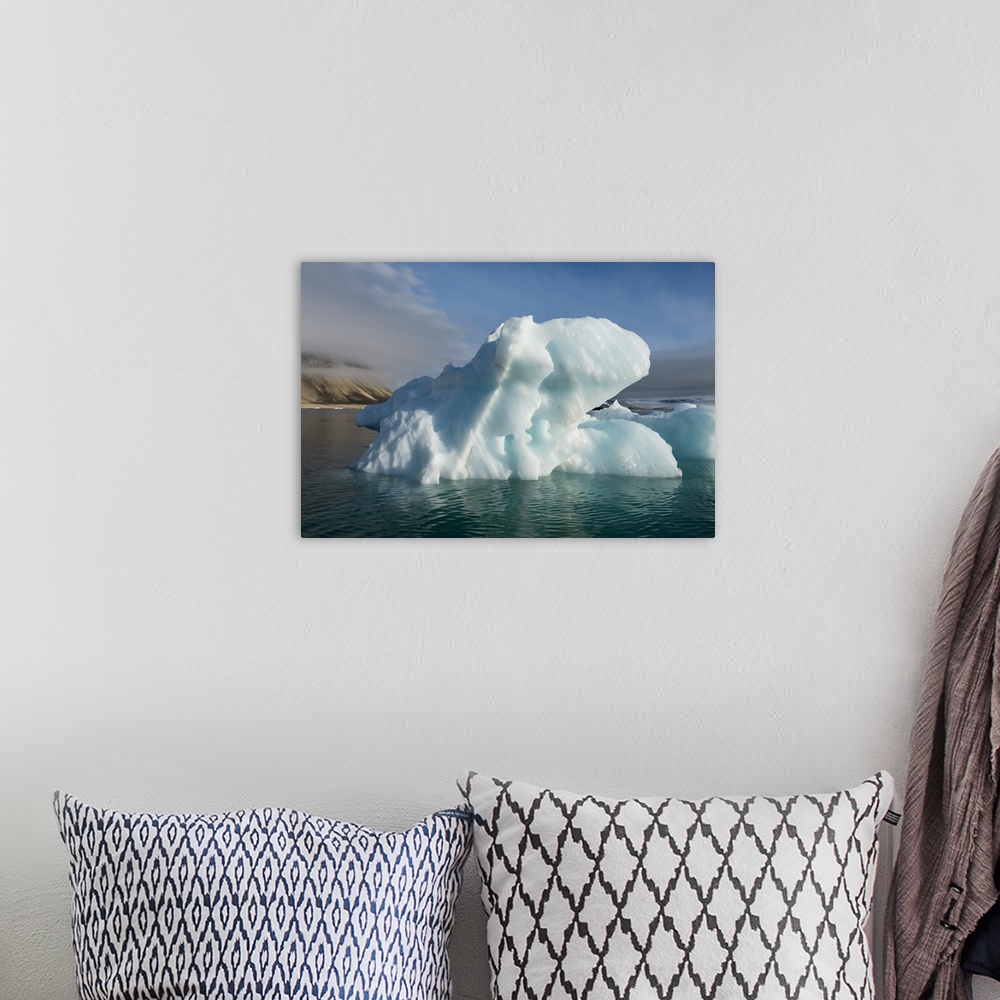 A bohemian room featuring Norway, Barents Sea, Svalbard, Nordaustlandet, Palanderbukta, Zeipelodden. Large iceberg.
