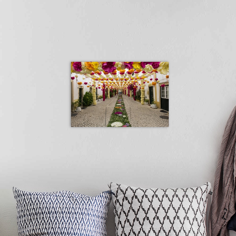 A bohemian room featuring Portugal, Santarem District. Trays Festival, Neighborhoods decorated with flowers and garlands.