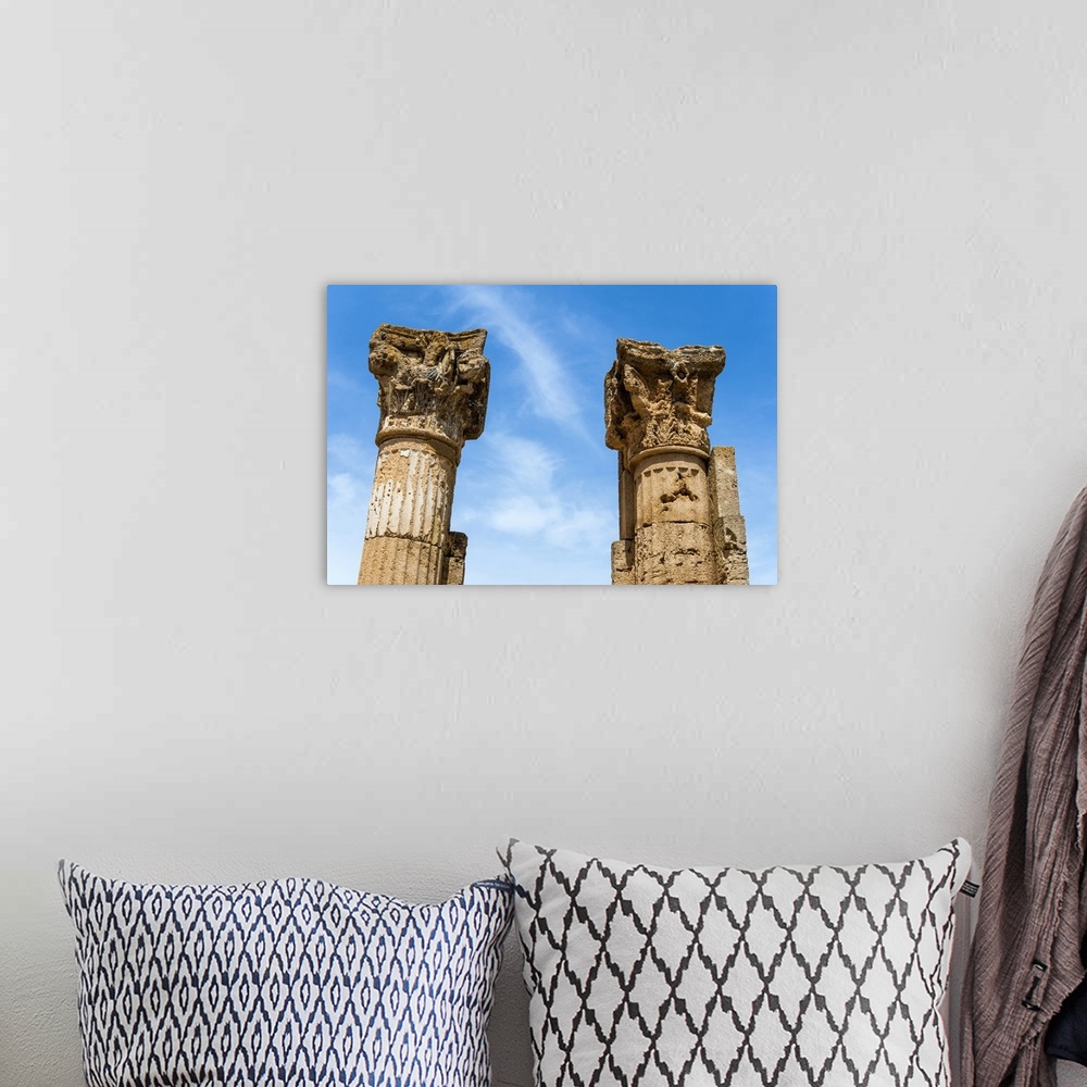 A bohemian room featuring Roman Corinthian capital, Utica Punic and Roman archaeological site, Tunisia, North Africa.
