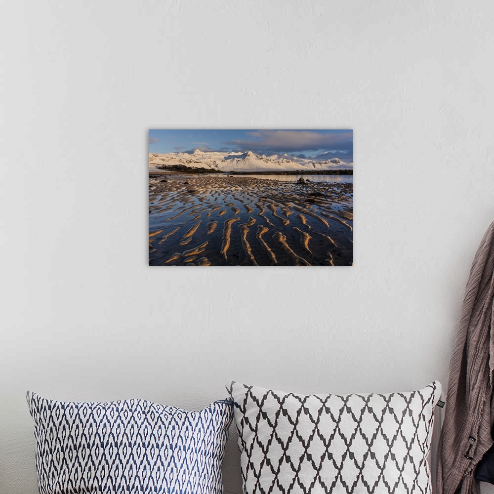 A bohemian room featuring Snow capped mountain above the North Atlanic shoreline on the Snaefellsnes peninsula in western I...