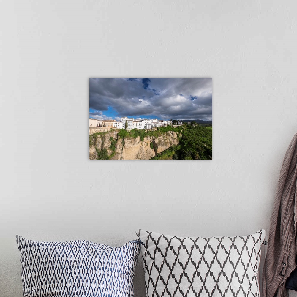 A bohemian room featuring Spain, Andalusia. Ronda perches on the rugged defensible limestone cliffs.