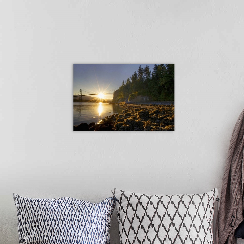 A bohemian room featuring Sun rising behind Lions Gate Bridge, Stanley Park, British Columbia