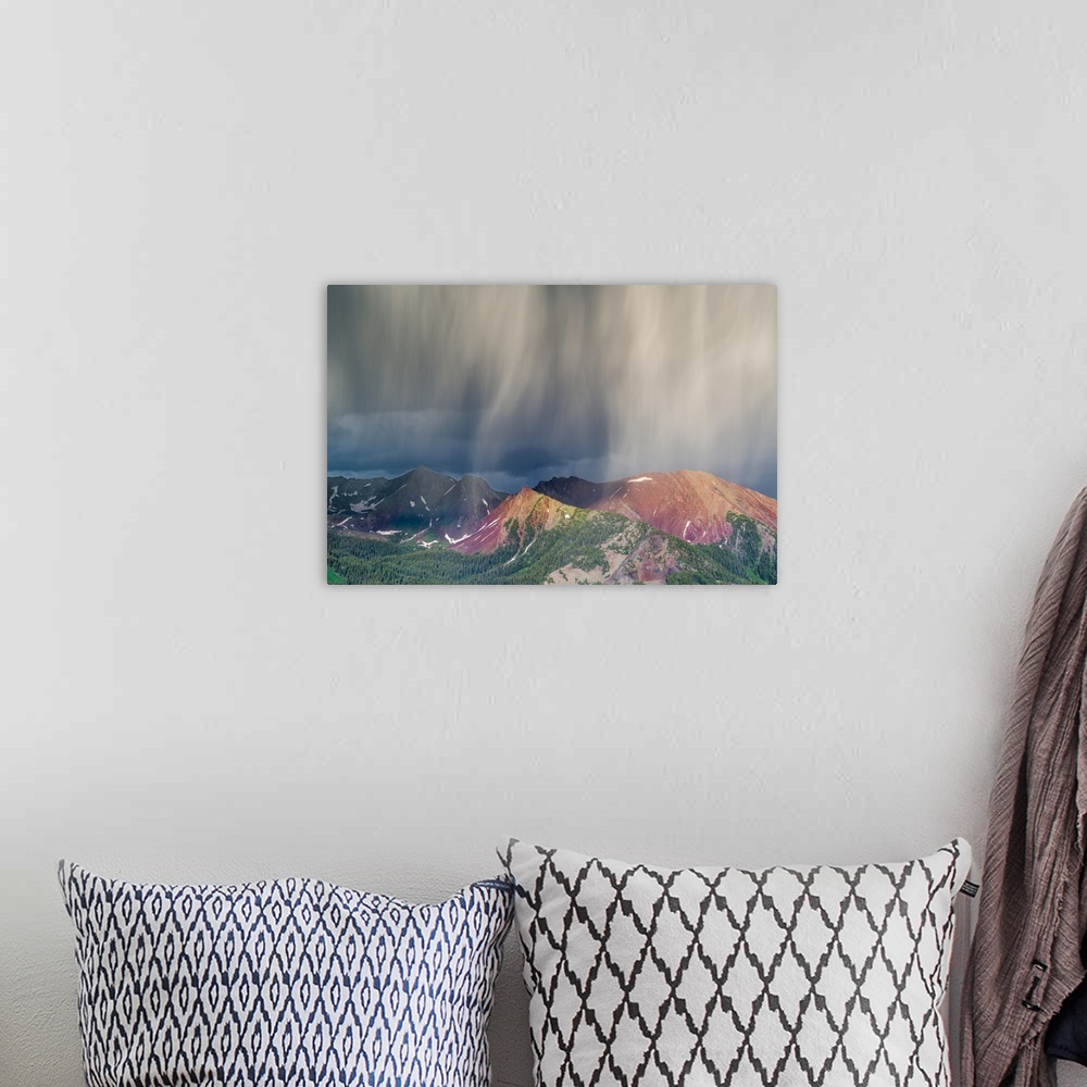 A bohemian room featuring Virga and storm moving over mountains near Crested Butte, Colorado