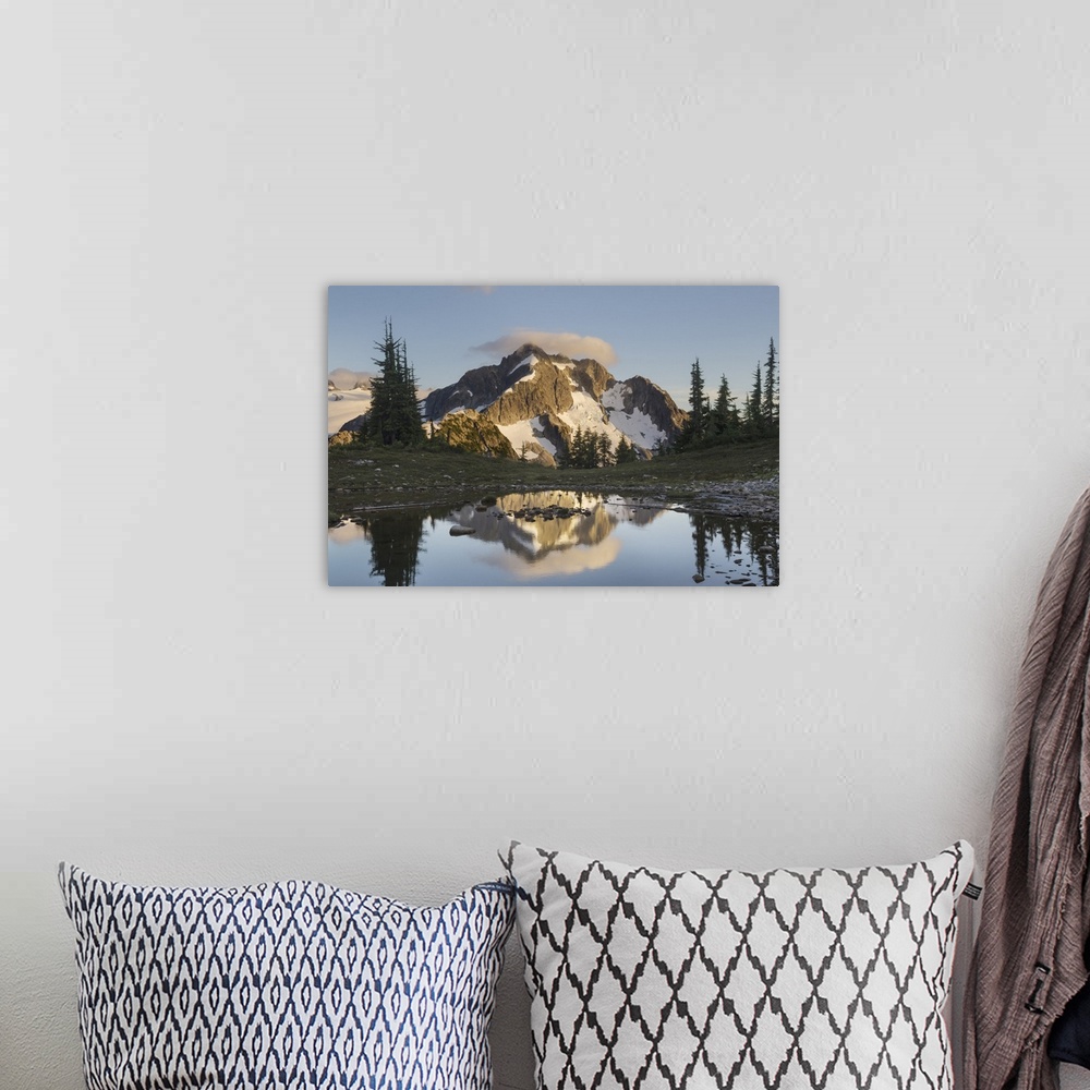 A bohemian room featuring Whatcom Peak reflected in Tapto Lake, North Cascades National Park