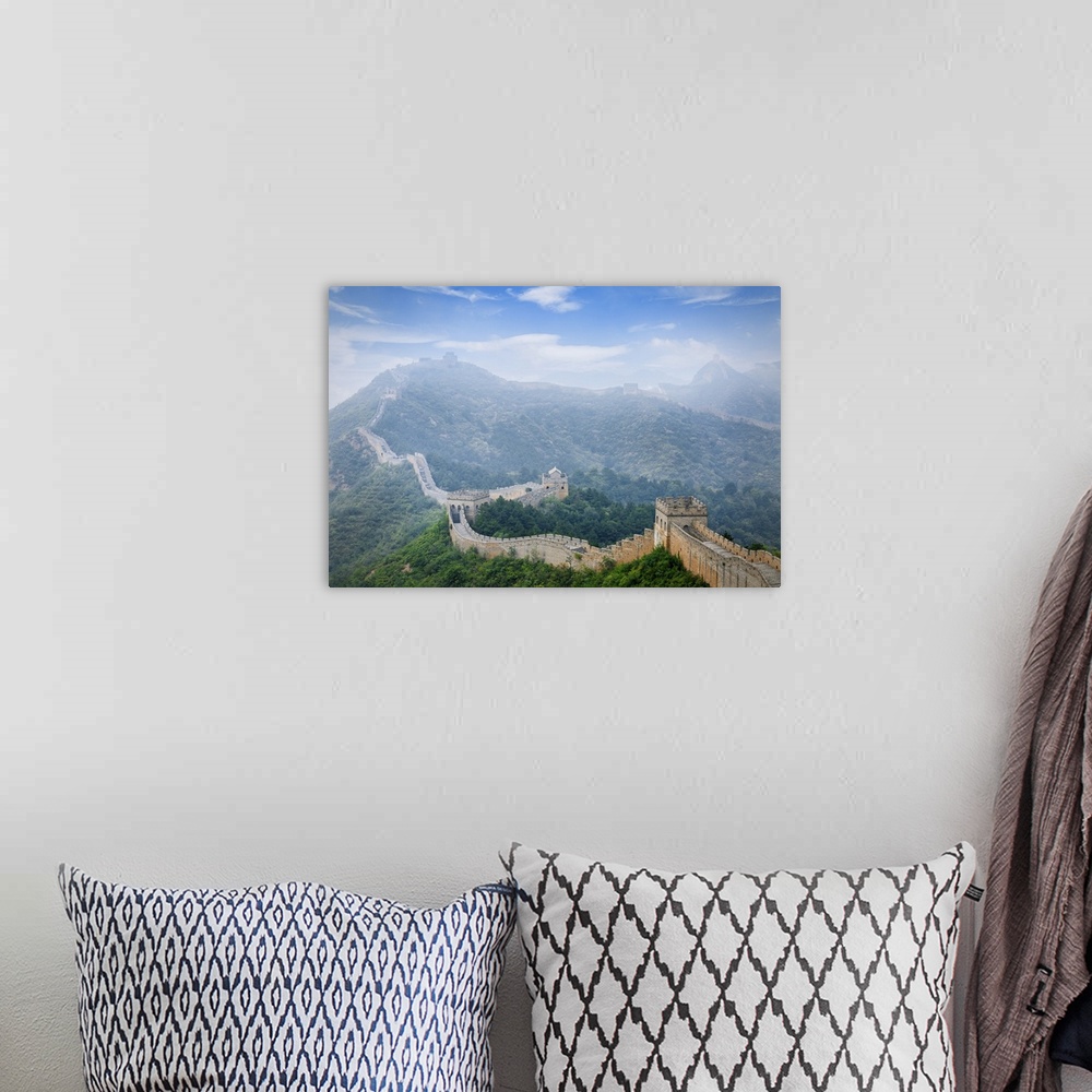 A bohemian room featuring Aerial view of great wall of China in fog in Jinshanling, Hebei Province, China.