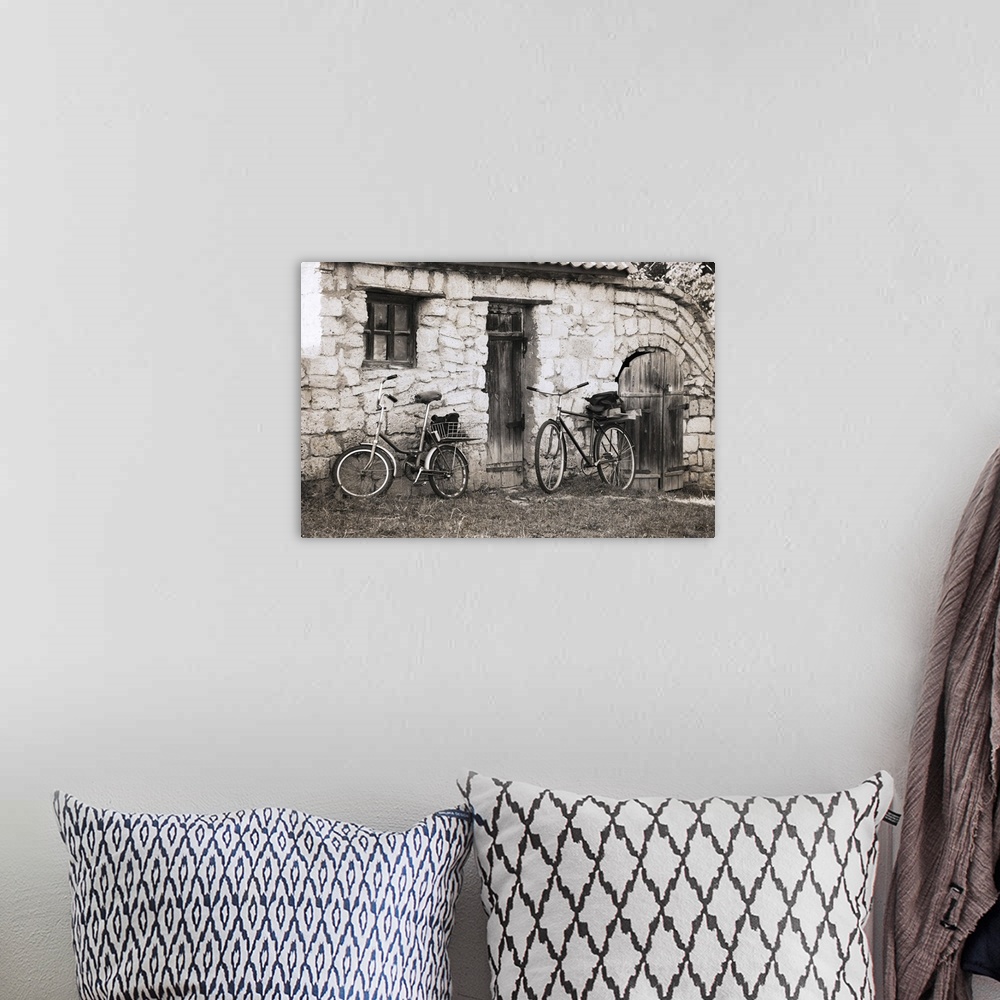 A bohemian room featuring Artwork in vintage style, bicycles.