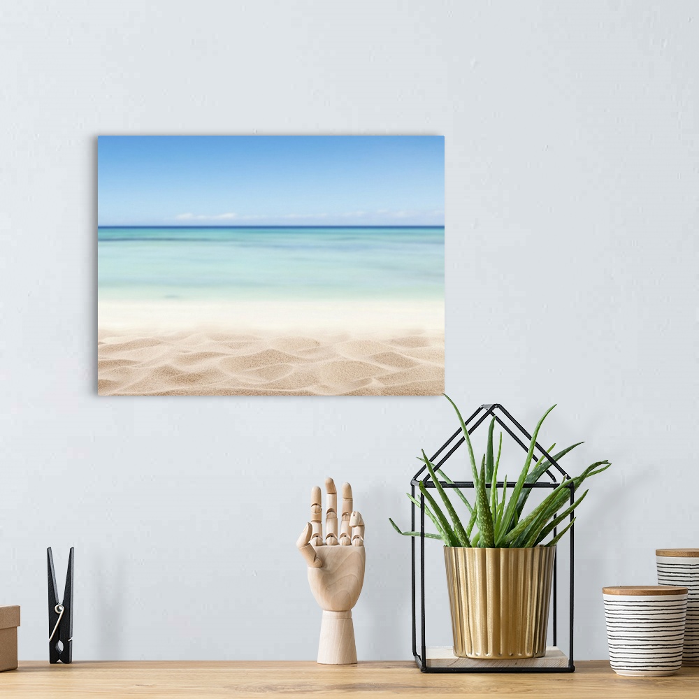 A bohemian room featuring Empty sandy beach with sea.