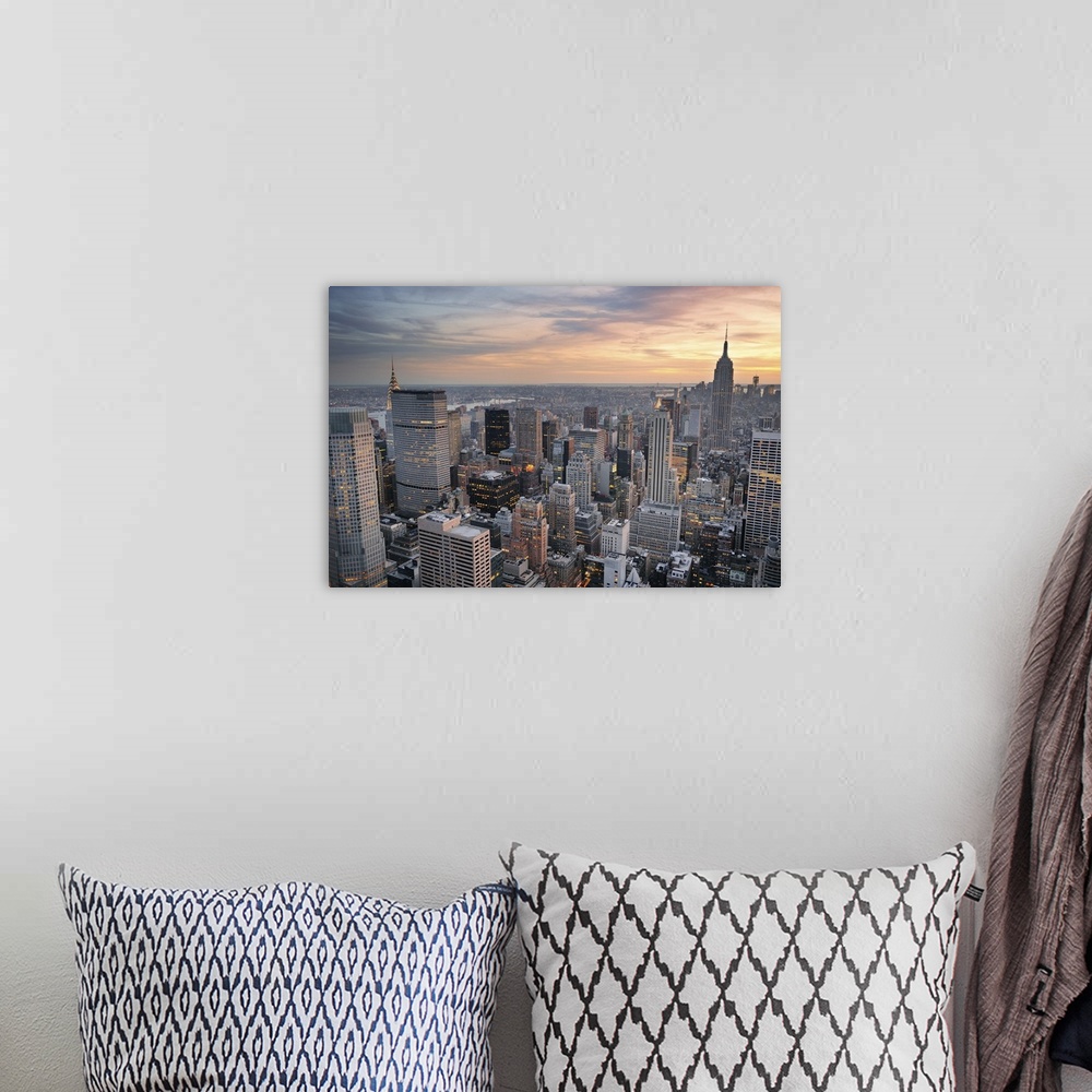 A bohemian room featuring New York City skyline aerial view at sunset with colorful cloud and skyscrapers of midtown Manhat...