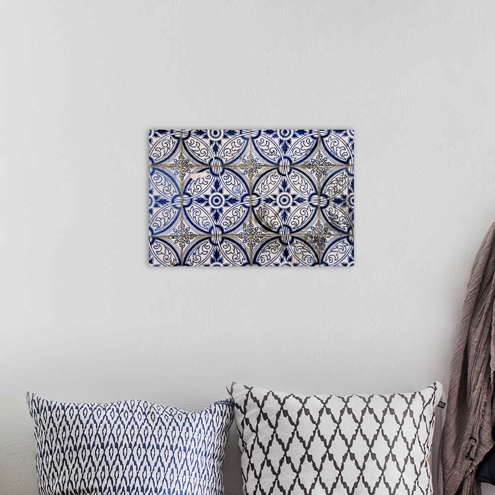 A bohemian room featuring Abstract pattern of Portuguese painted tiles with interesting designs.