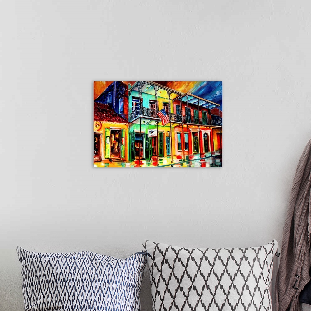 A bohemian room featuring Contemporary painting of wet city street lined with shops that have balconies.