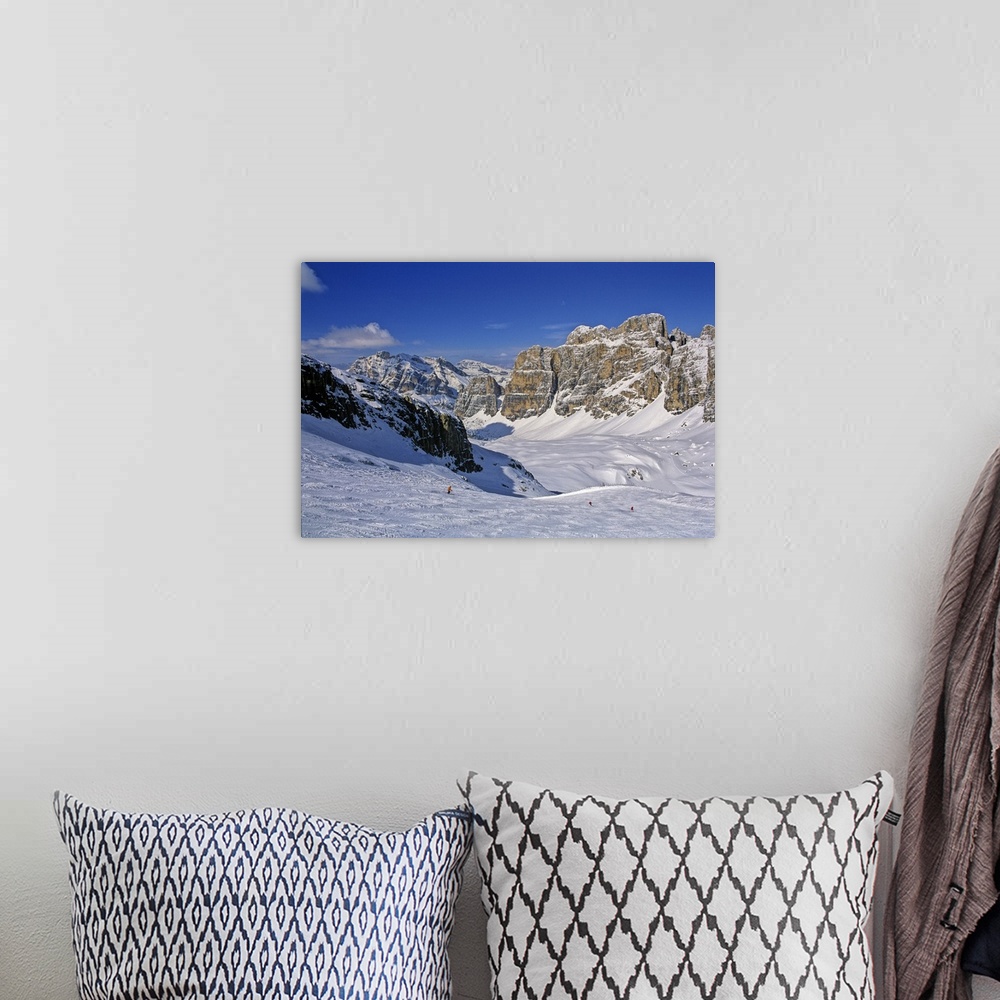 A bohemian room featuring Italy, Cadore, Cortina d'Ampezzo, Skiers descend the slopes near Lagazuoi mountain