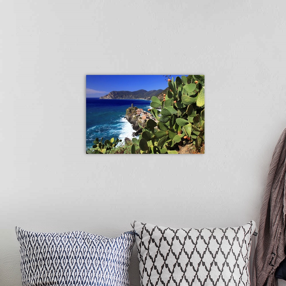 A bohemian room featuring Italy, Liguria, Cinque Terre, Prickly pear trees with Vernazza