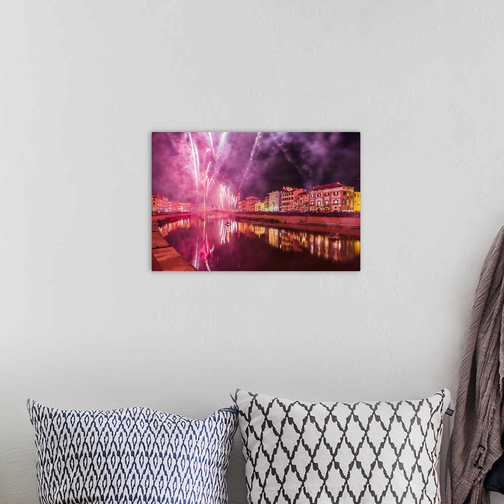 A bohemian room featuring Italy, Tuscany, Pisa district, Pisa, Fireworks at the Arno River waterfront during the Luminara d...