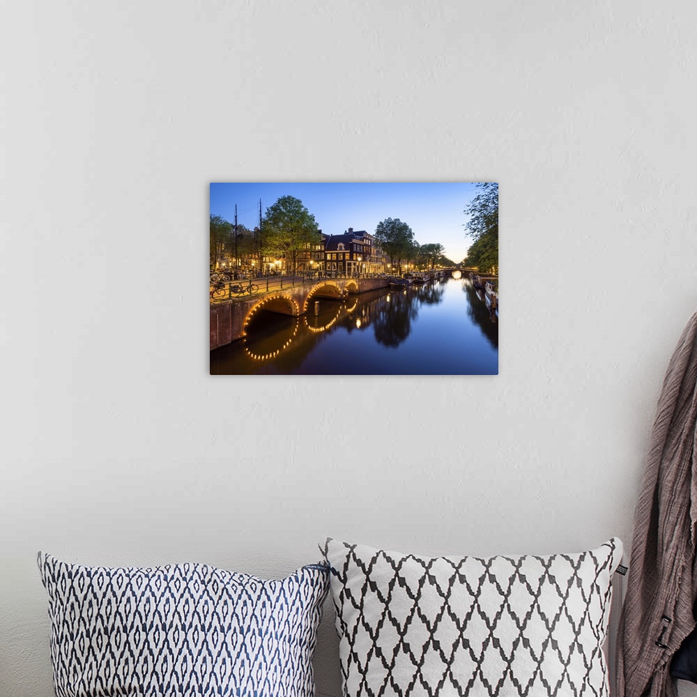 A bohemian room featuring Netherlands, North Holland, Amsterdam, Keizersgracht, Benelux, Keizersgracht at dusk.